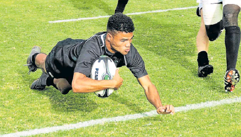 Pearson wing Taine-Josh Thorne crosses for the team’s lone try against Daniel Pienaar in their rugby match at Pearson on Saturday