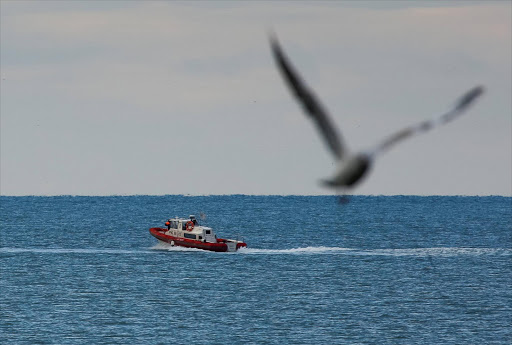 A boat of Russian Emergencies Ministry sails near the crash site of a Russian military Tu-154 plane, which crashed into the Black Sea on its way to Syria on Sunday, in the Black Sea resort city of Sochi, Russia, December 26, 2016. REUTERS/Maxim Shemetov