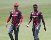 The Tshwane Spartans bowler Lutho Sipamla (R) chats to his captain AB de Villiers during the Mzansi Super League Twenty20 match against the Nelson Mandela Bay Giants at SuperSport Park in Centurion on November 25 2018.     