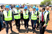 President Cyril Ramaphosa chats with Gauteng premier  David Makhura at  the  launch of the Tshwane Automotive Hub  in Silverton, Pretoria, yesterday.