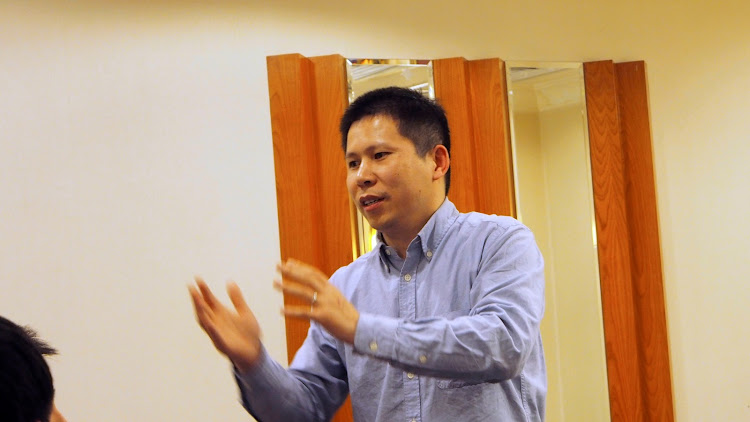 Chinese rights advocate Xu Zhiyong speaks during a meeting in Beijing, China, in this handout photo dated March 30 2013.