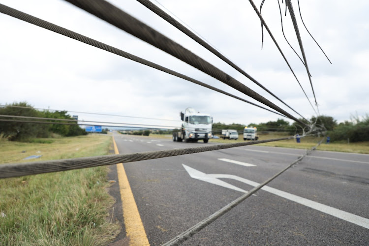 Part of an electrical pylon lies across the N4 near Pretoria. Picture: ANTONIO MUCHAVE