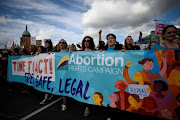 Demonstrators hold posters as they march for more liberal Irish abortion laws in Dublin, Ireland September 30, 2017. 