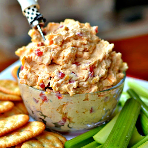 This easy to make flavor packed Southern Pimento Cheese is sure to be the hit of your next party.  To take it over the top serve in little steamed red potatoes.