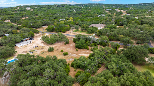 Aerial view, house and pool surrounded by trees - Prestige land for sale in Bulverde