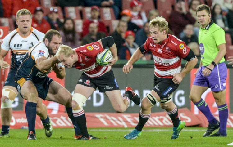 Ross Cronje of the Lions tackled during the Super Rugby match between Emirates Lions and Brumbies at Emirates Airline Park on May 19, 2018 in Johannesburg, South Africa.