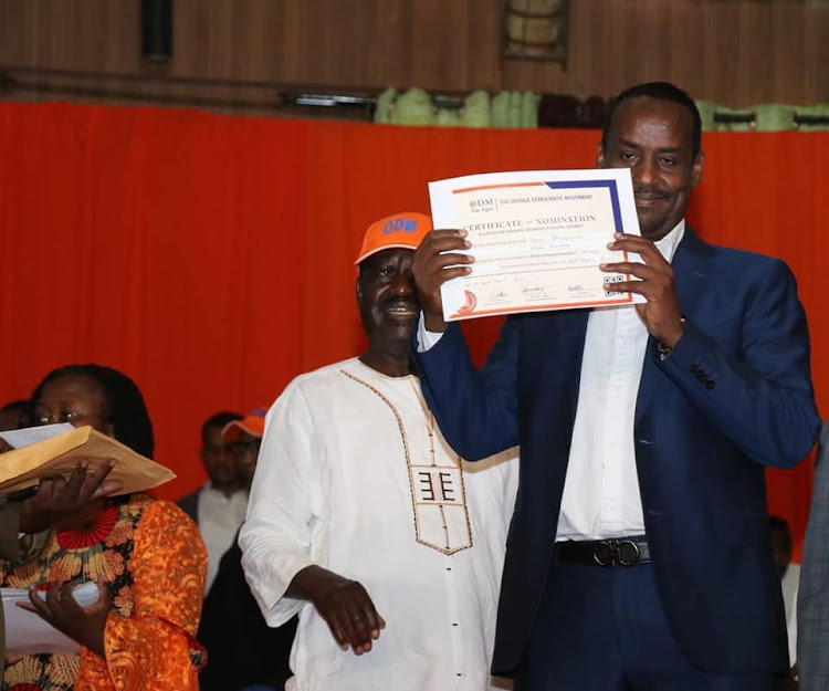 Former Al Jazeera journalist Mohamed Adow displays his ODM certificate on Wednesday, April 20.