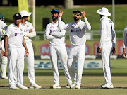 India's Virat Kohli and his teammates were left incredulous after a LBW decision against SA captain Dean Elgar was overturned at Newlands.  