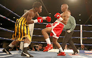 Thabang Ramagole, pictured here in a previous fight against   Collen Tloubatla, registered his eighth knockout on Friday.