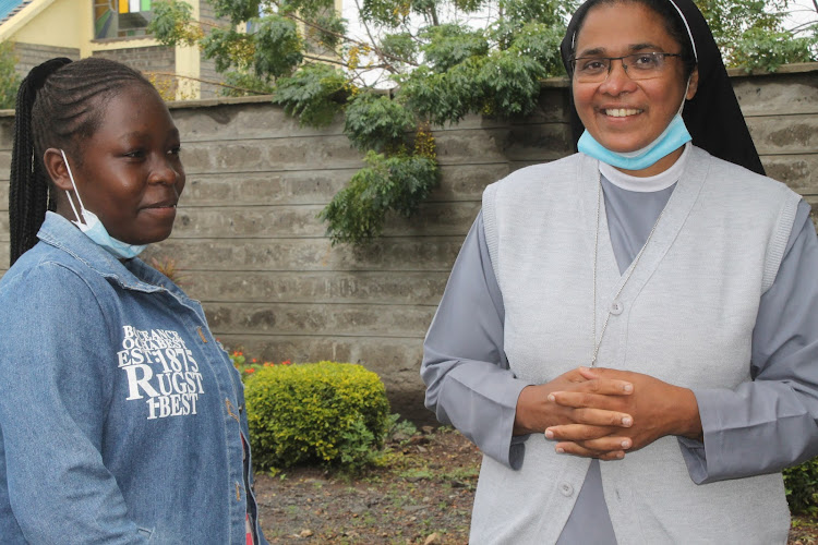 Marion Ondisa with Brigida Morello Girls Secondary school principal Sister Sweta Abraham at the institution in Katani, Machakos County on Friday, May 14.