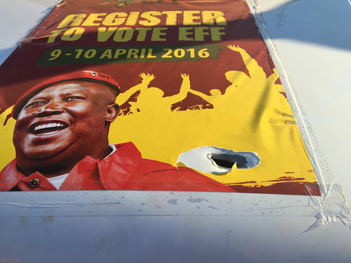 A bullet hole is seen on a vehicle that had an Economic Freedom Fighters (EFF) poster of Julius Malema that resulted from a shooting at the KaMaqhekeza stadium in KaMaqhekeza (formerly Naas) outside Komatipoort.