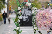 A photograph from late singer Tina Turner adorned with flowers is pictured on the Hollywood Walk of Fame in Los Angeles, California, U.S., May 24, 2023. 