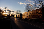 Trucks standing in line while rideing towards border crossing point on April 16, 2022 in Kybartai, Lithuania. Russia's Kaliningrad exclave, on the shore of the Baltic Sea, is sandwiched between NATO members Lithuania and Poland and is the Baltic coasts most strategic transport and trade port.