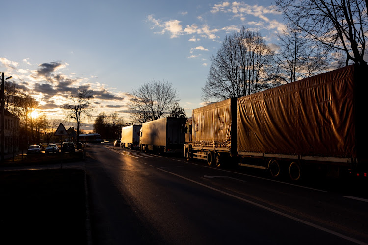 Trucks standing in line while rideing towards border crossing point on April 16, 2022 in Kybartai, Lithuania. Russia's Kaliningrad exclave, on the shore of the Baltic Sea, is sandwiched between NATO members Lithuania and Poland and is the Baltic coasts most strategic transport and trade port.