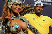 Usain Bolt of Jamaica interacts with samba dancers during a press conference of the Jamaican Olympic Association and PUMA in Barra during the Rio 2016 Olympic Games in Rio de Janeiro, Brazil, 08 August 2016.  EPA