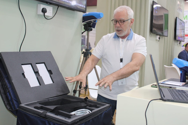 Igor Kuzmich, the technical director of Techno-Med, a medical consortium based in St Petersburg in Russia, displays a suitable that carries the 12-kilogramme portable x-ray in Nairobi.