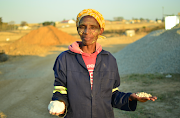 Mthatha woman and maize farmer showing local produce manufacturing process