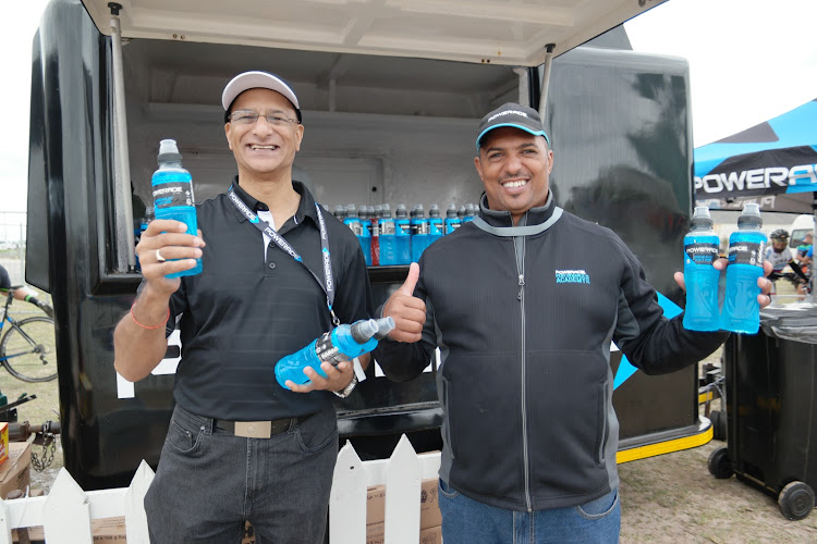 TOPPING UP: Official hydration partners Coca Cola Beverages South Africa will be waiting at the finish line at the 2020 Herald Cycle Tour to keep all riders refreshed and hydrated. Powerade drinks will be handed over to riders and Bonaqua waters to the children. Kas Naidoo, left, regional special events manager KZN, and Brendon Prince, special events team leader, created some hype and excitement at the finish line at the 2019 race