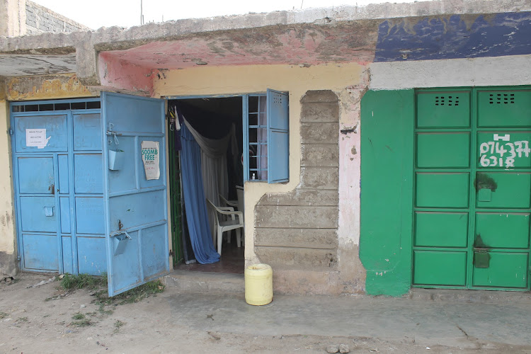 Faith Mumo mother's tailoring shop