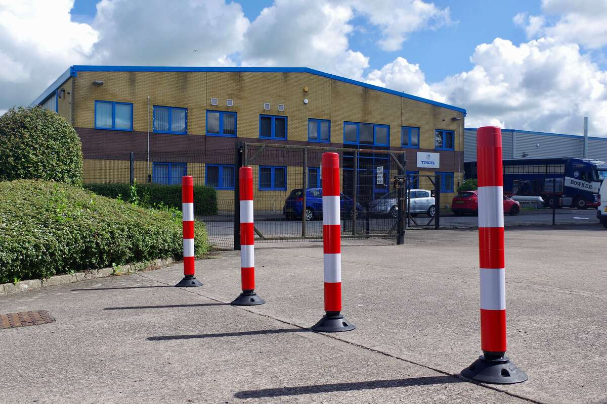 Traffic Cone Guide; Flexible Posts in Hi-Viz Red and White in a commercial car park. 