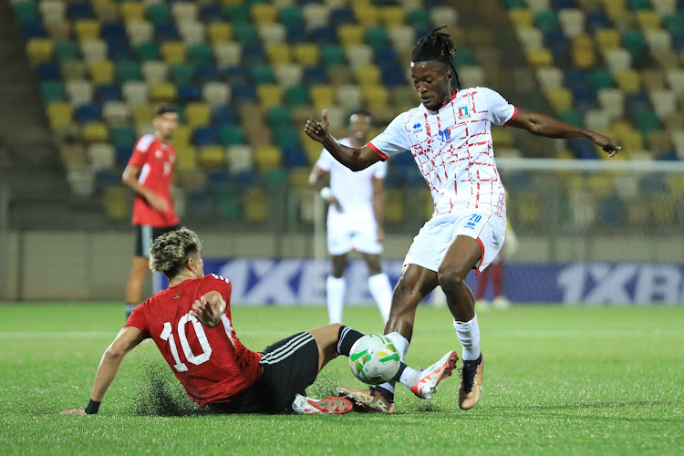 Libya's Fahad Al Mesmari challenges Equatorial Guinea's Santiago Bocari Eneme during the final AFCON qualifier game that ended in a 1-1 draw