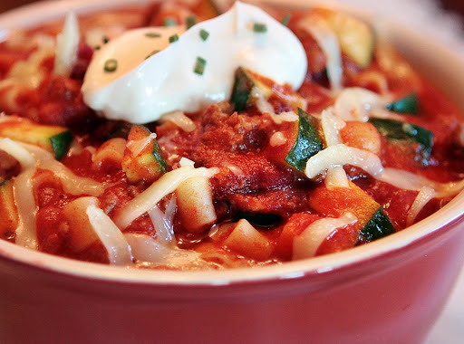 A very hearty chili that is a complete meal in a bowl! It can be made mild or spicy and would even make a great vegetarian meal if you left out the meat.