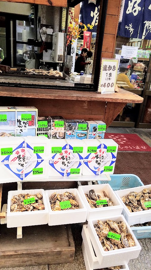 Hiroshima Day trip to Miyajima. The oysters in Hiroshima are famous, particularly the ones from Miyajima because there are many oyster farms located here for the past 400 years or so. You will see multiple stands offering quick grab and go raw or grilled oysters all along the streets.