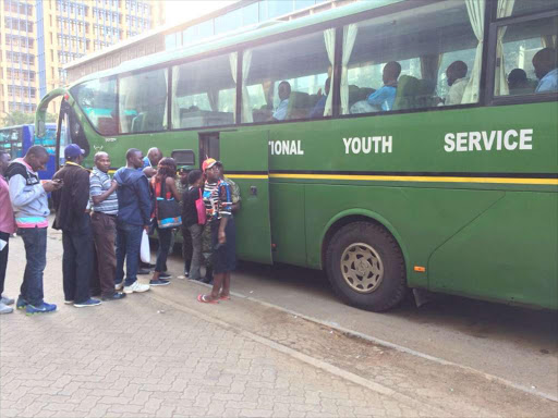 Commuters queue to board an NYS bus at Kencom bus stop.
