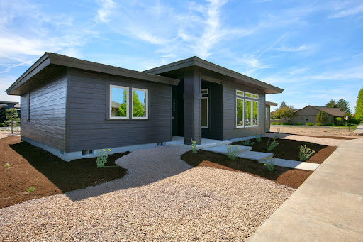 Modern house exterior with landscaped garden in this luxury property for sale in Prineville ($545,000 - 181 m²)