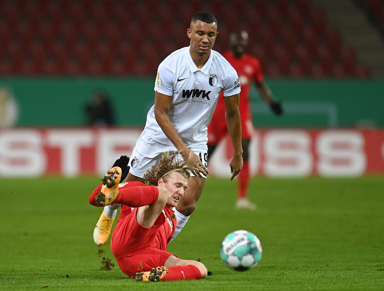 RB Leipzig's Emil Forsberg in action with Augsburg's Felix Uduokhai