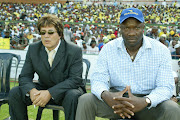 Peter Koutroulis and Roger Feutmba on the bench.