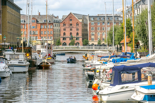 copenhagen-boat-under-footbridge.jpg - A tour boat passes beneath a canal footbridge in Copenhagen. 