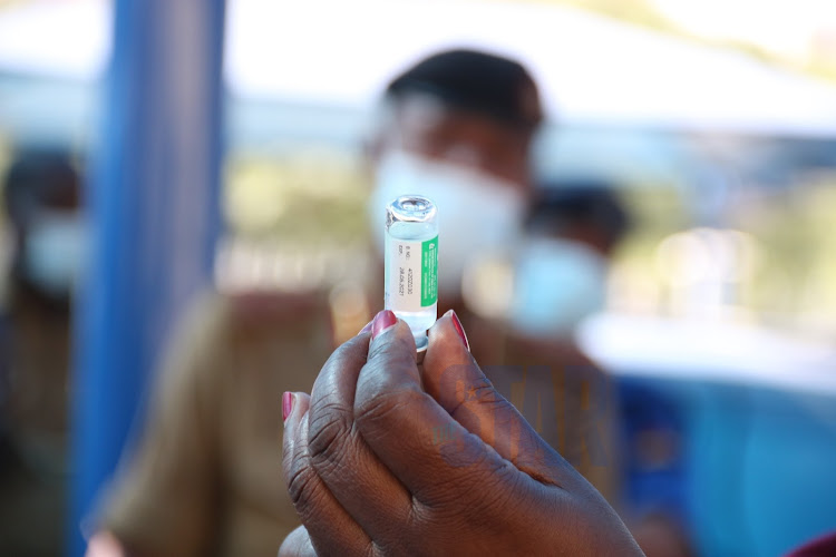 Immunisation specialist Lucy Kanja prepares covid-19 immunisation jab