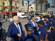 The DA's Western Cape premier candidate, Alan Winde, meets members of the rail enforcement unit on the Grand Parade in Cape Town on January 29 2019.