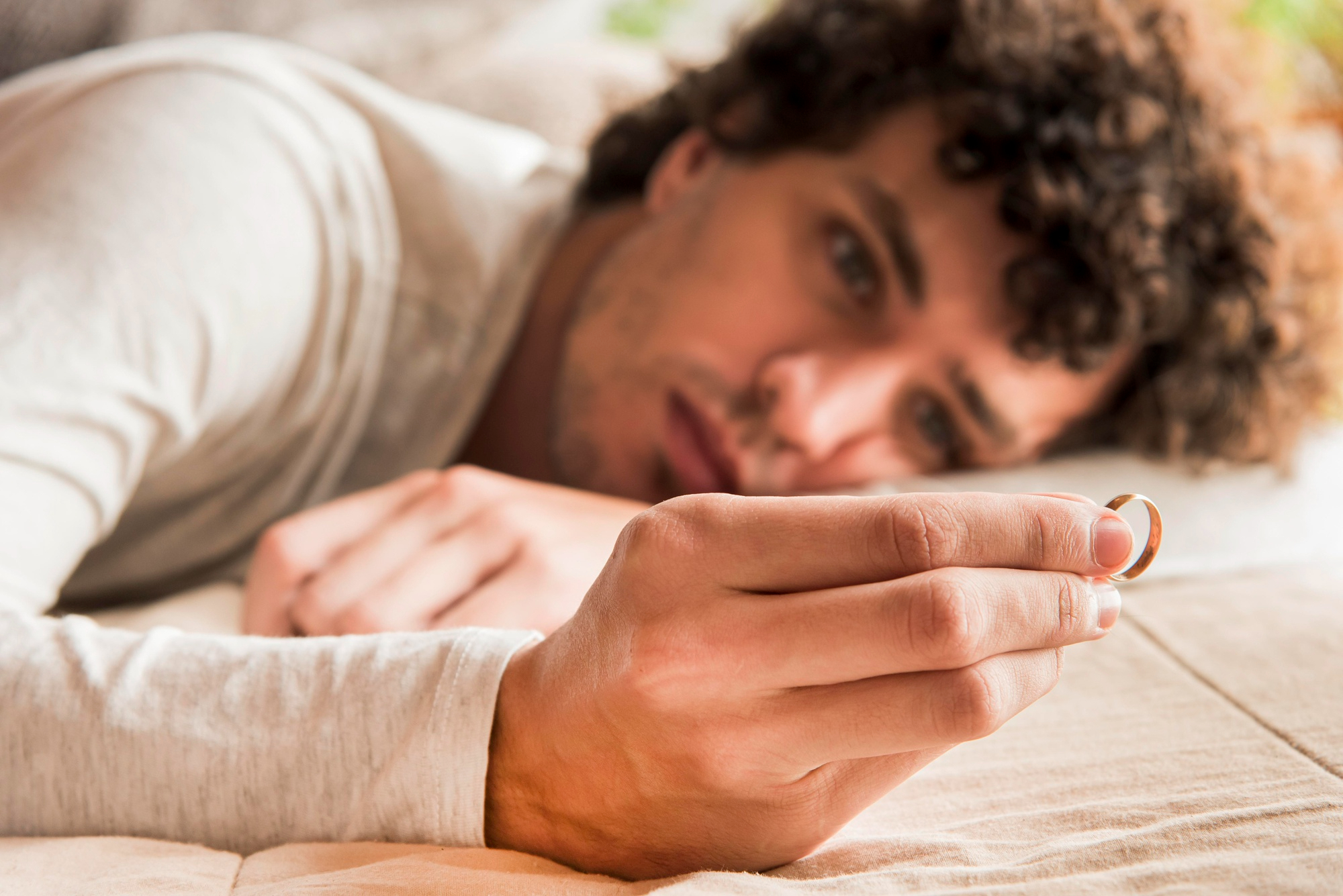 man holding wedding ring