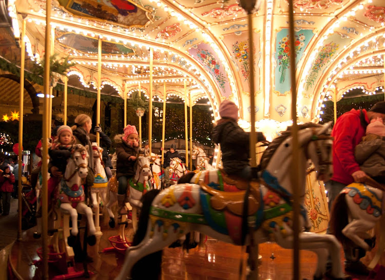 Children ride the carousel during the Christmas market in Trier, Germany. 