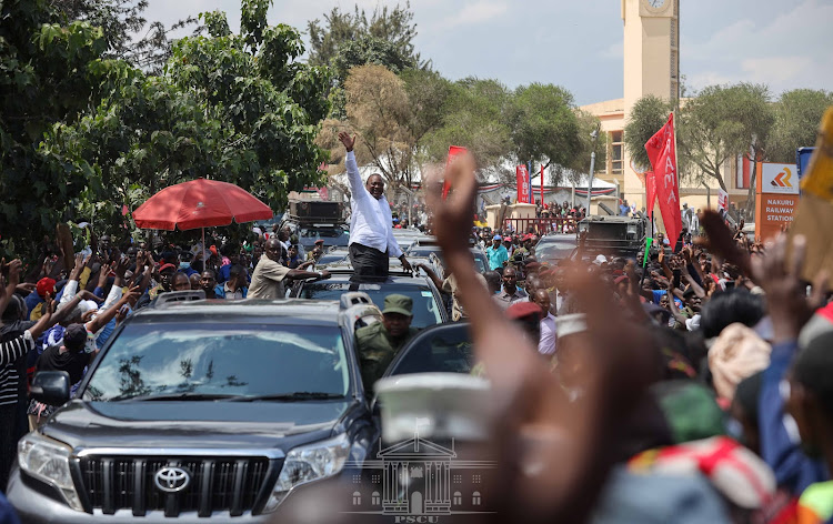 President Uhuru Kenyatta waving at the crowd after he commissioned the refurbished Nakuru Railway Station and addressed residents.