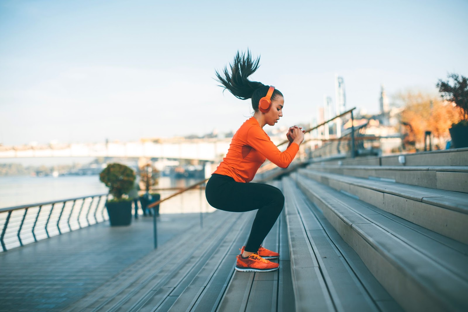 A woman exercising outdoors.