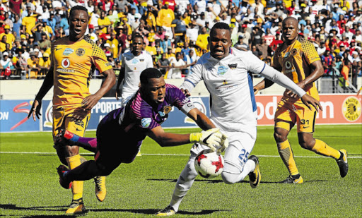 BLOCKED: Itumeleng Khune of Kaizer Chiefs steals the ball from Lerato Manzini of Chippa United during their Telkom Knockout quarterfinal game at Nelson Mandela Bay Stadium yesterday. Chippa lost 1-0, bringing their unbeaten run under caretaker coach Teboho Moloi, which lasted eight matches, to an end Picture: GALLO IMAGES