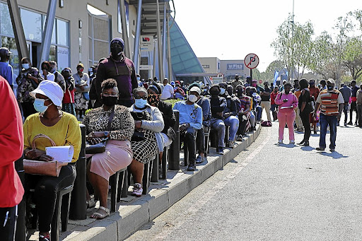 Queueing for the R350 social relief of distress grant at Soweto’s Maponya Mall. Picture: FANI MAHUNTSI/GALLO IMAGES