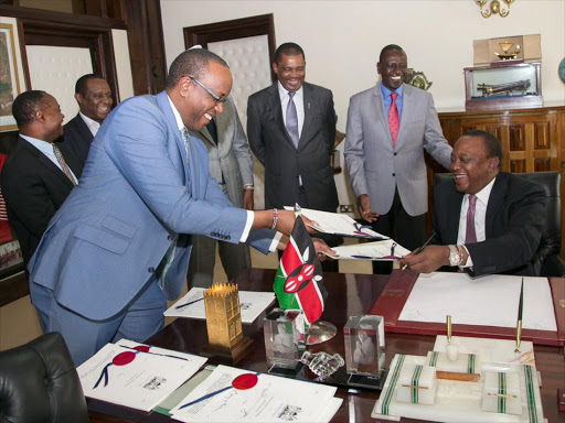 President Uhuru Kenyatta, DP William Ruto and other state officials during the signing of the Proceeds of Crime and Anti-Money Laundering (Amendment) Act and the Supplementary Appropriation Act on Friday, March 3, 2017, at State House, Nairobi. /PSCU