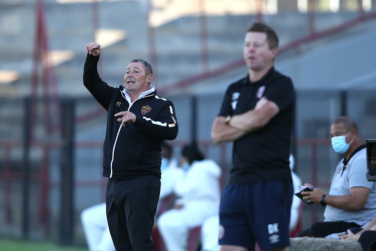 Stellenbosch coach Steve Barker barks out instructions to his team as his Swallows counterpart Dylan Kerr looks on.