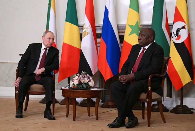 Russian President Vladimir Putin and South African President Cyril Ramaphosa attend a meeting in Saint Petersburg, Russia June 17, 2023.