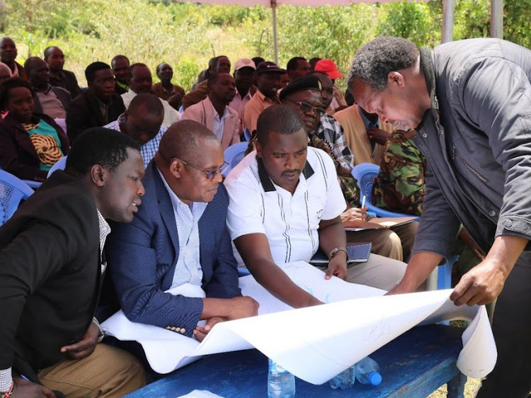 KVDA officials led by Chairman Jackson Kiptanui (seated center) during a meeting at Kimwarer on the proposed Sh28 billion dam on October 18.