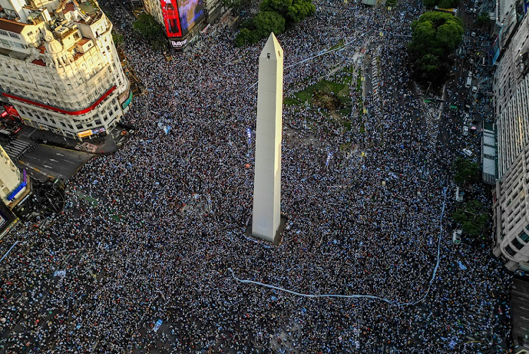 Aerial view as Argentine fans celebrate at the Obelisk in Buenos Aires, Argentina after their team's World Cup semifinal victory against Croatia on December 13 2022.