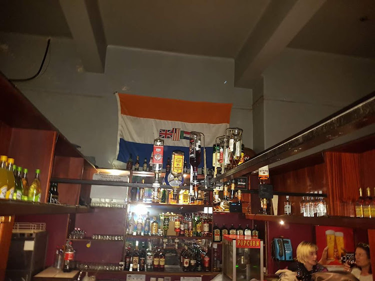 One user took to social media to detail the experience his friends had when they had enquired why the old South African flag was up on the wall.