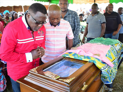 Kilifi Deputy Governor Gideon Saburu and Kaloleni MP Paul Katana view the body of Katana Kazungu, a 17-year-old pupil at Ndatani Primary School in Kaloleni who was shot dead by police last Tuesday. Photo/JOHN CHESOLI