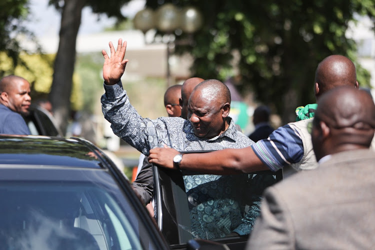 President Cyril Ramaphosa waves to journalists after leaving the venue where the National Working Committee meeting of the ANC is taking place, 04 December 2022, at Nasrec in Johannesburg. Ramaphosa recused himself from the meeting so that members of the NWC can deliberate on issues relating the Phala Phala farm scandal.