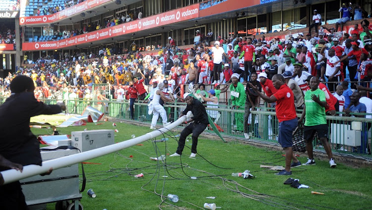 Orlando Pirates fans storm the pitch during an Absa Premiership match between Mamelodi Sundowns and Orlando Pirates at Loftus Stadium in Pretoria in February last year.