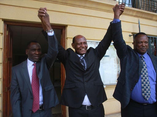 Moi University DVC Students Affairs Prof Natha Oyieri, VC Richard Mibey, DVC Admininistration and Planning Prof Paul Kiprop celebrate outside Milimani law courts yesterday /PHILIP KAMAKYA